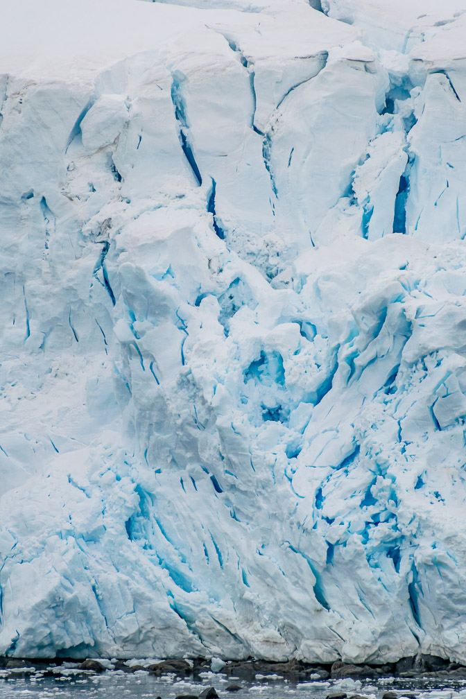 Intense blue glow in the stress cracks as the glacier turns  0318